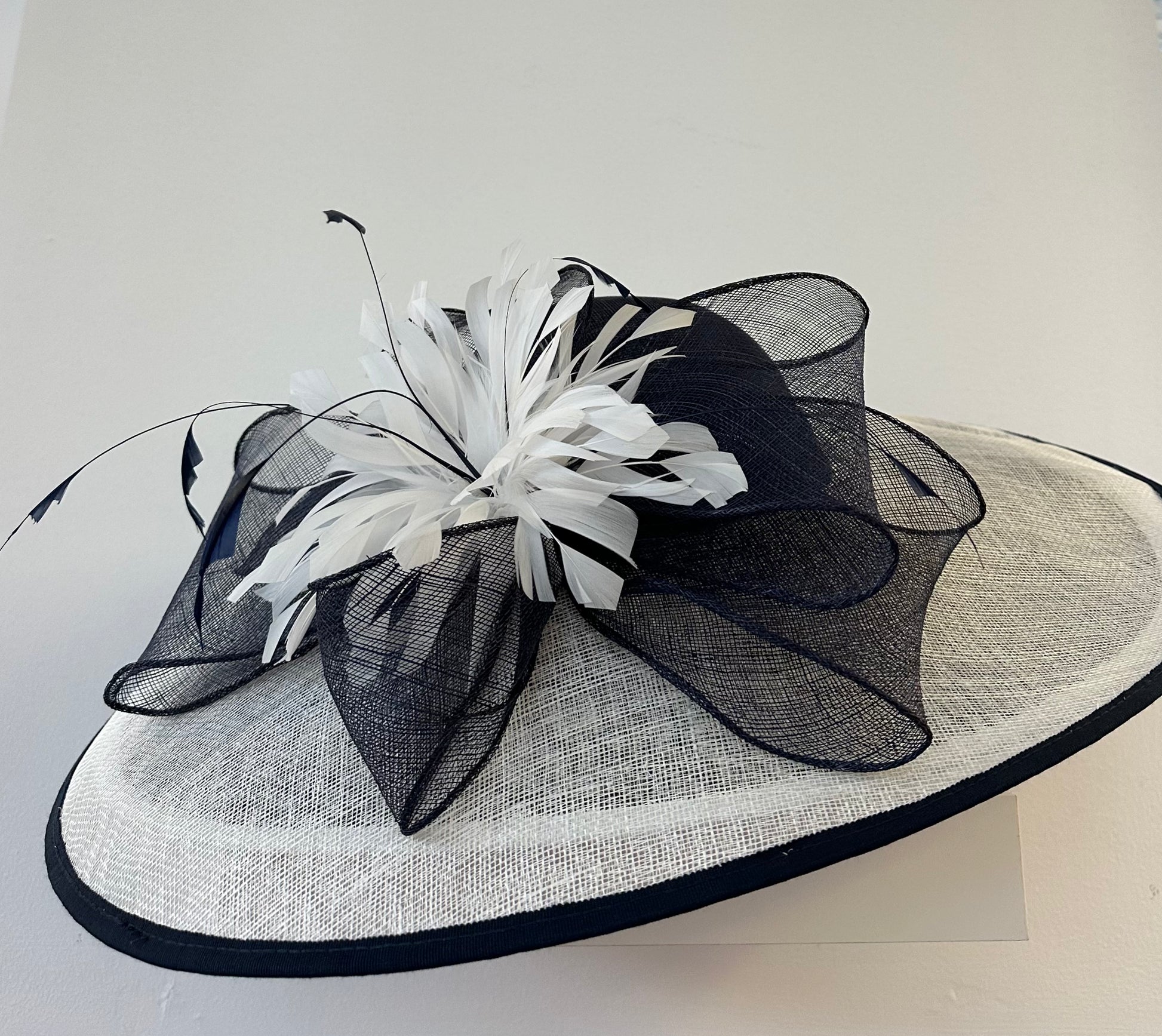 White hats and shop fascinators