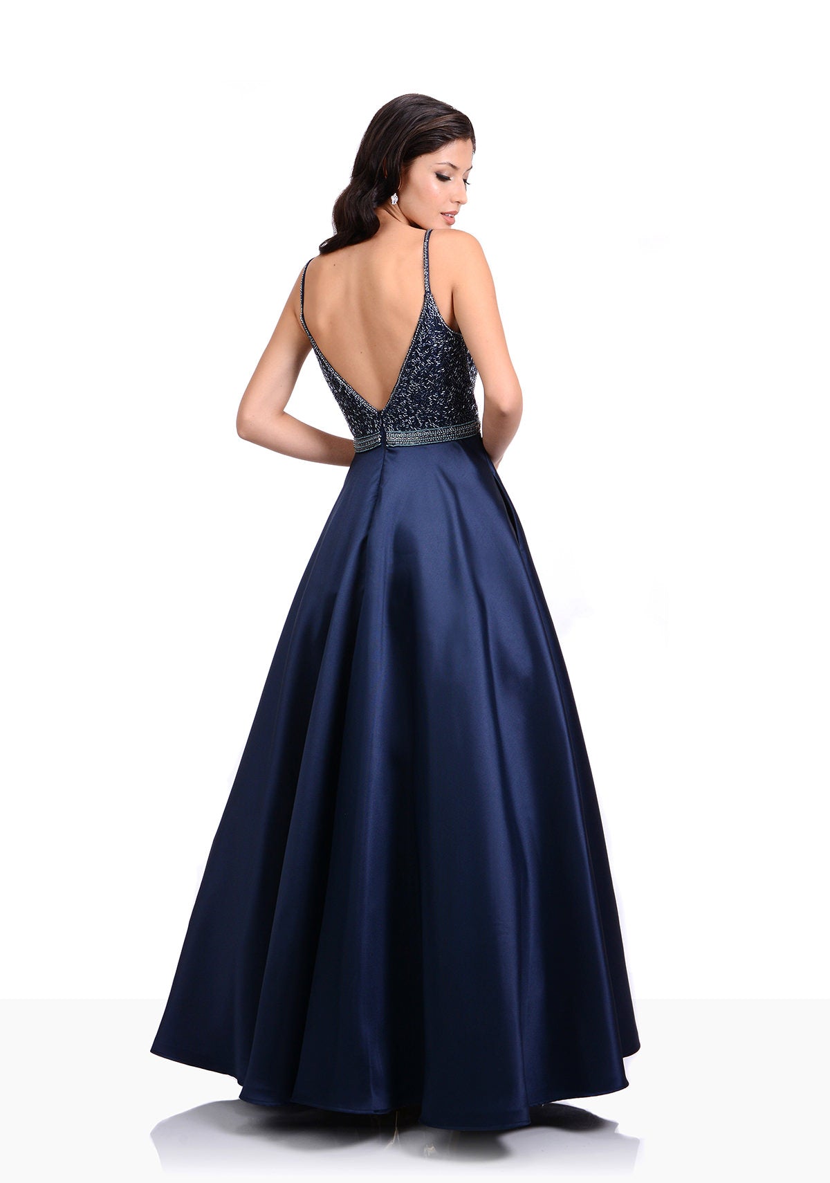 Striking Mikado a-line dress with plunging bodice. Embellished deep v neckline with highlighting waist detail.  Navy prom or evening dress. 